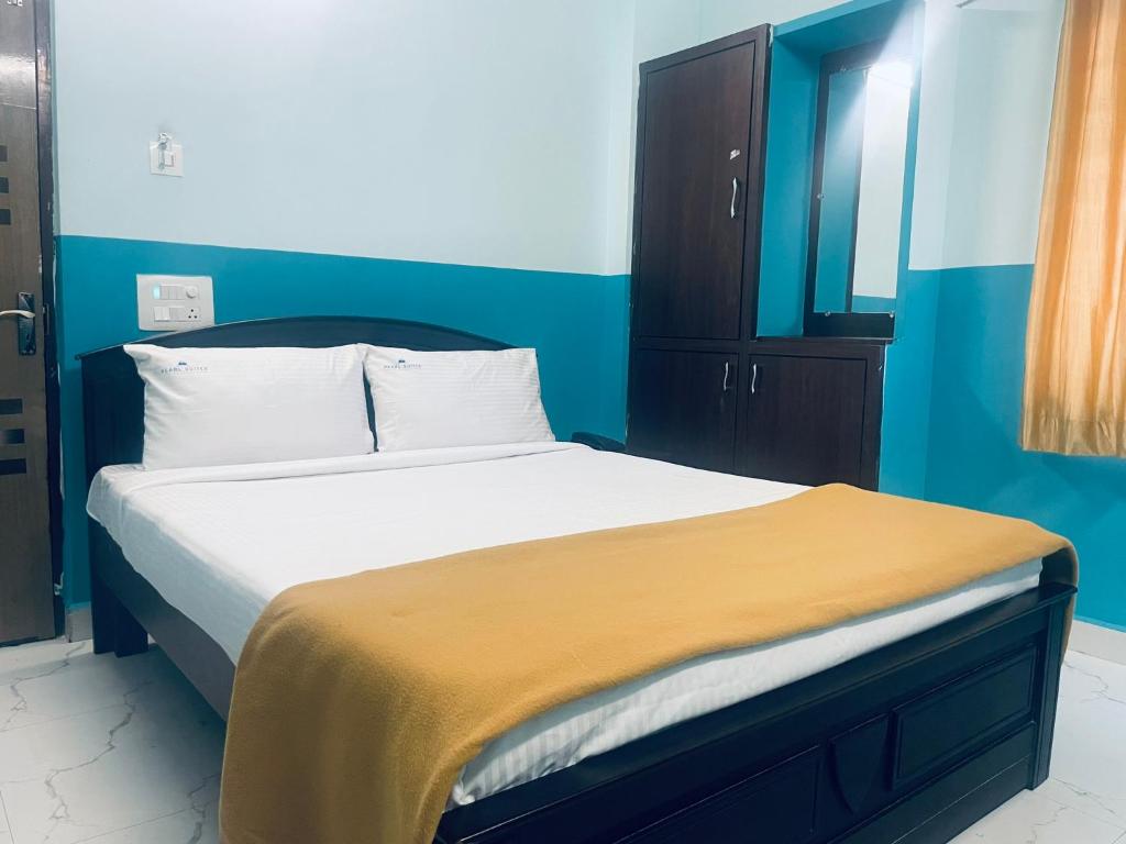 Postel nebo postele na pokoji v ubytování Hotel Deccan Park, Tirupati