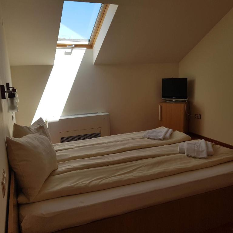 Postel nebo postele na pokoji v ubytování Motel Vector