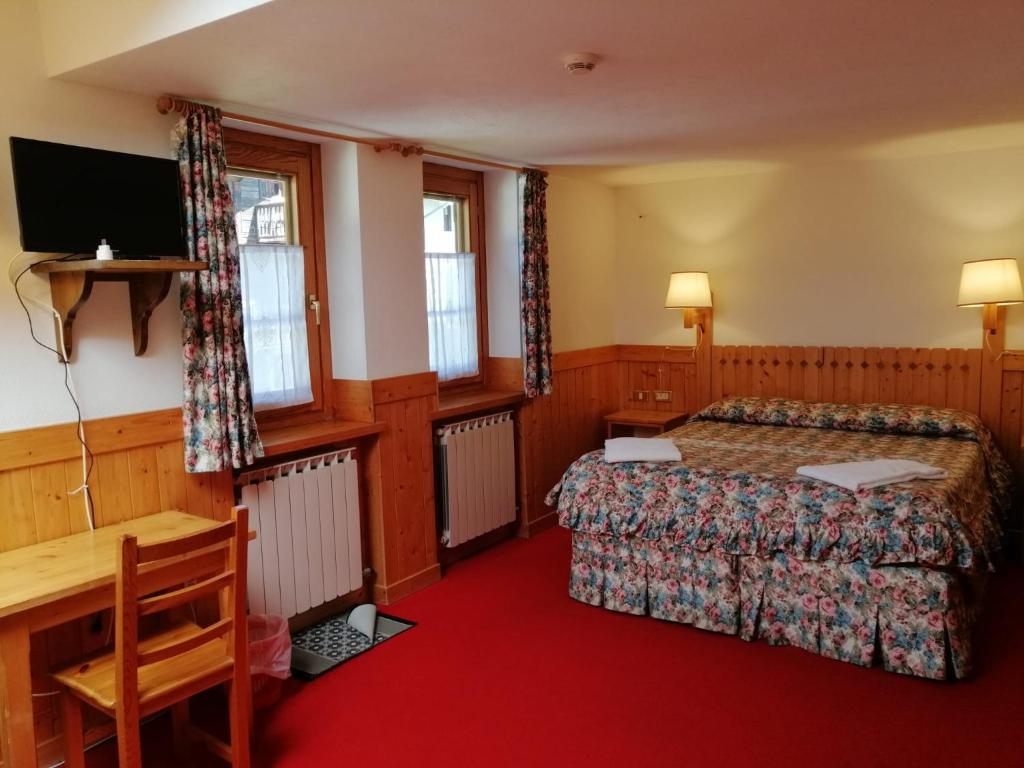 Postel nebo postele na pokoji v ubytování Hotel Locanda Grauson
