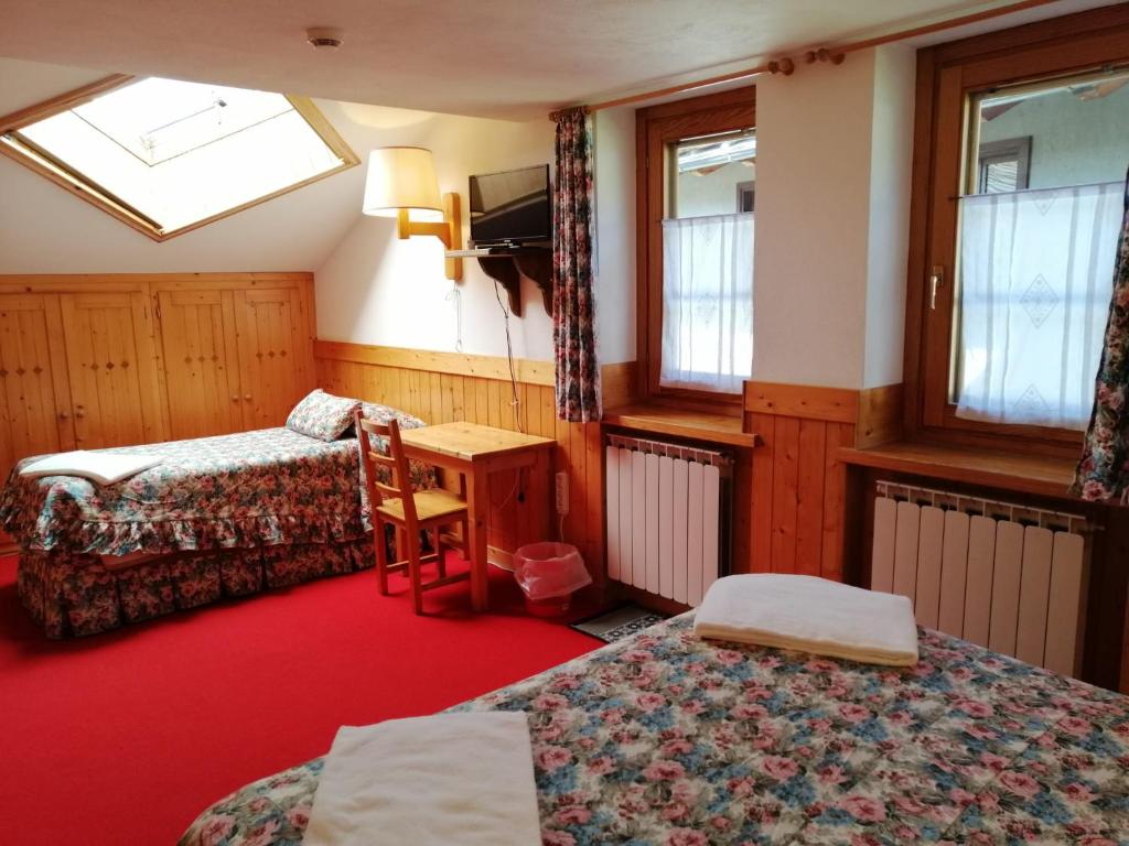 Postel nebo postele na pokoji v ubytování Hotel Locanda Grauson