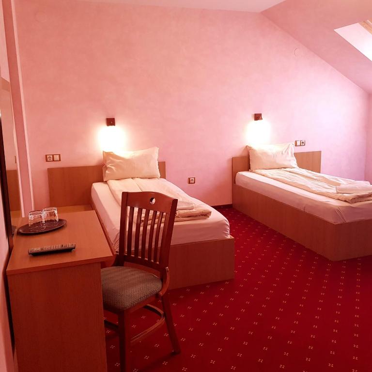 Postel nebo postele na pokoji v ubytování Motel Vector