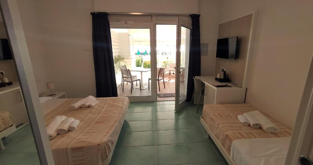 Postel nebo postele na pokoji v ubytování Hotel Residence Arturo