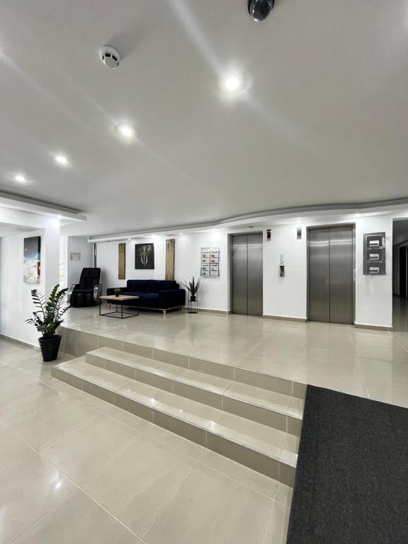 TV a/nebo společenská místnost v ubytování Hotel Recif