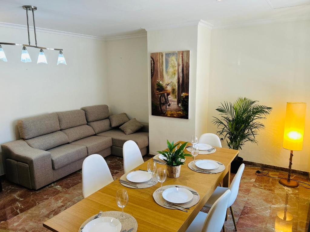 a living room with a table and a couch at ISABEL Apartment in Puerto de Sagunto