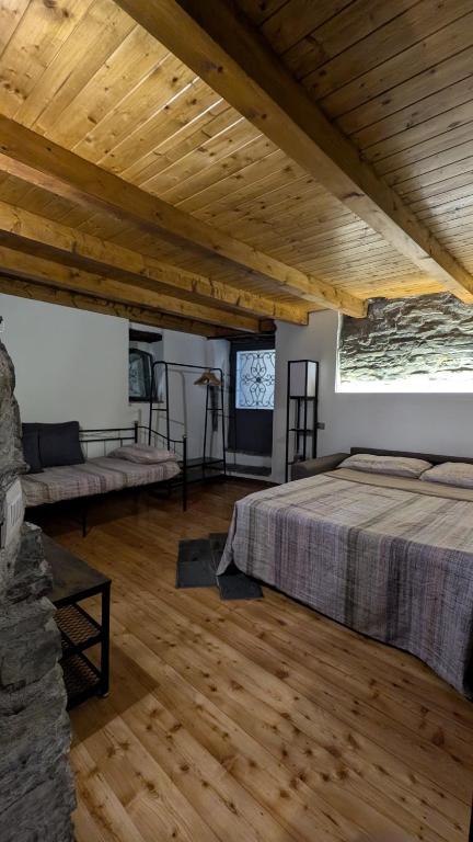 Postel nebo postele na pokoji v ubytování Il rustico DN ART holidays home - alloggio tipico