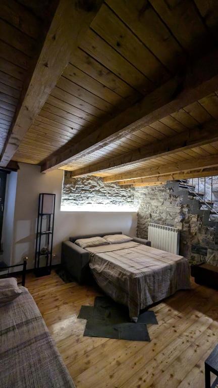 Postel nebo postele na pokoji v ubytování Il rustico DN ART holidays home - alloggio tipico