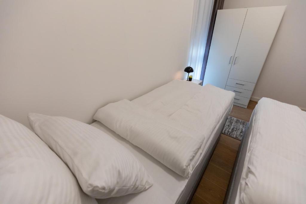 Postel nebo postele na pokoji v ubytování Apartmani Maira