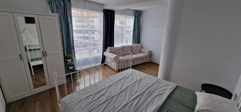 Postel nebo postele na pokoji v ubytování Apartamente Dragasani