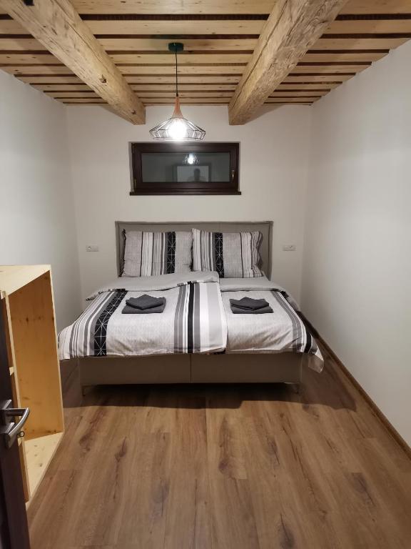 Postel nebo postele na pokoji v ubytování Apartmány Faustin