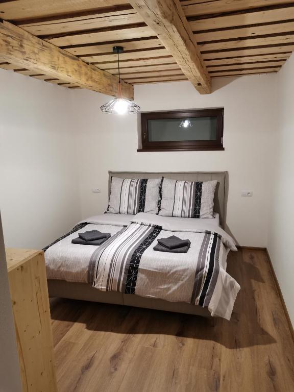Postel nebo postele na pokoji v ubytování Apartmány Faustin