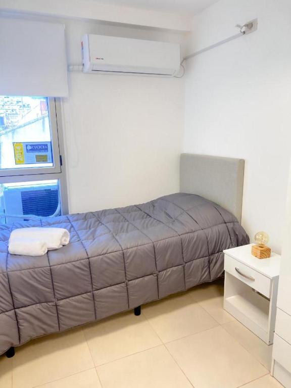 Postel nebo postele na pokoji v ubytování BORGES HOUSE APARTS Apartamentos con cochera a dos cuadras del Obelisco!