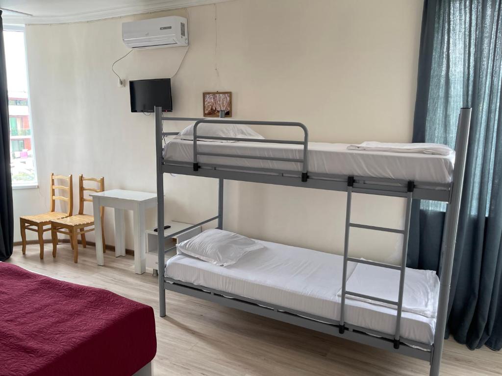 Postel nebo postele na pokoji v ubytování Barakat Hotel