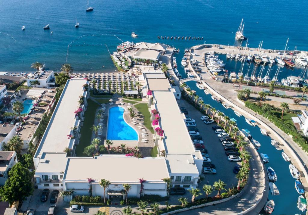 an aerial view of a resort with a marina at Lugga Boutique Hotel & Beach in Ortakent