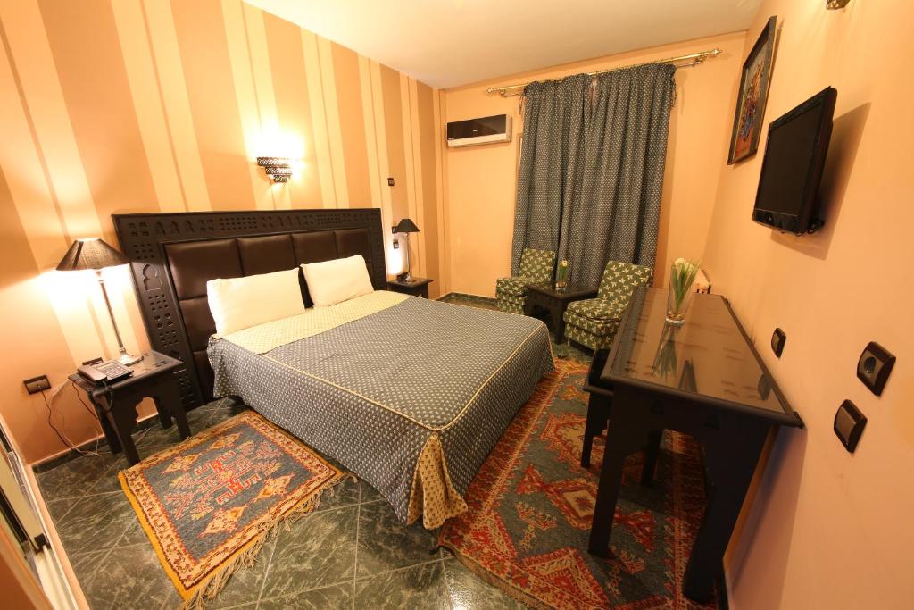 Postel nebo postele na pokoji v ubytování Hotel Akouas