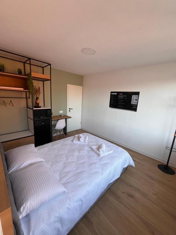 Postel nebo postele na pokoji v ubytování Moxa Residence