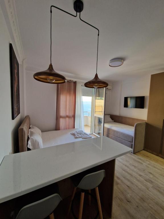 Postel nebo postele na pokoji v ubytování Borns Seaside Apartments