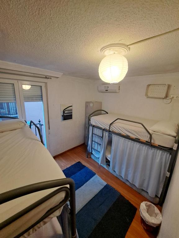 Posteľ alebo postele v izbe v ubytovaní Hostel El Cascabel