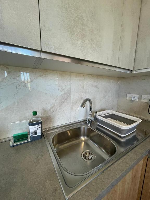Kuchyň nebo kuchyňský kout v ubytování OpenView Apartment Marsaxlokk