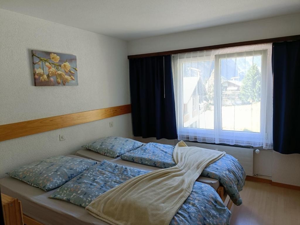 Postel nebo postele na pokoji v ubytování Kummublick Täsch, Nähe Zermatt