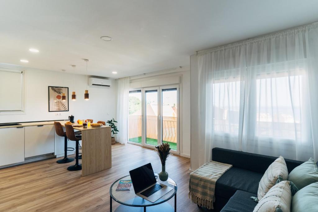 a living room with a couch and a table at Almare Suites - Aguadulce Vistas al mar in Aguadulce