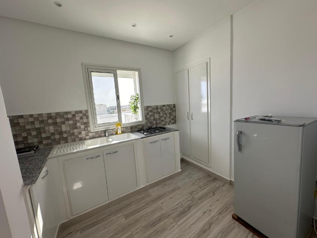 Kuchyň nebo kuchyňský kout v ubytování Penthouse Sousse