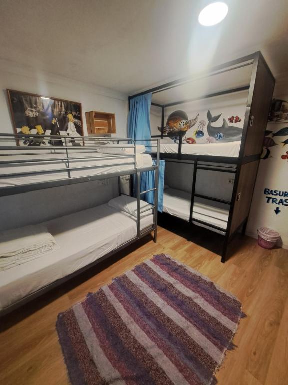 Posteľ alebo postele v izbe v ubytovaní Hostel El Cascabel