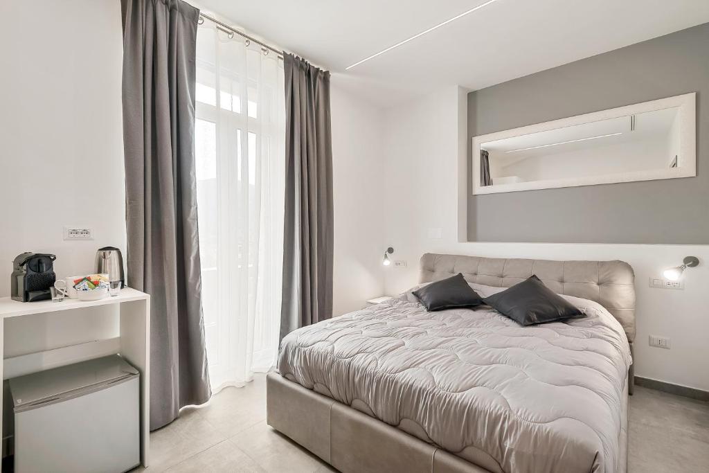 Postel nebo postele na pokoji v ubytování Home 501 Guest House - La Spezia