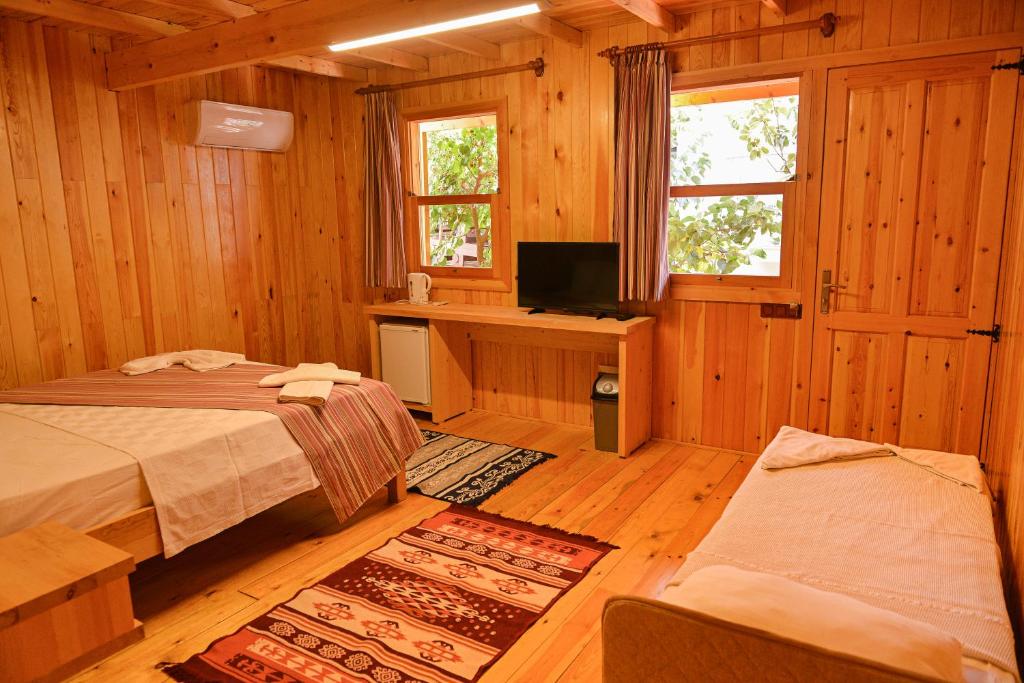 Postel nebo postele na pokoji v ubytování Tolay Hotel