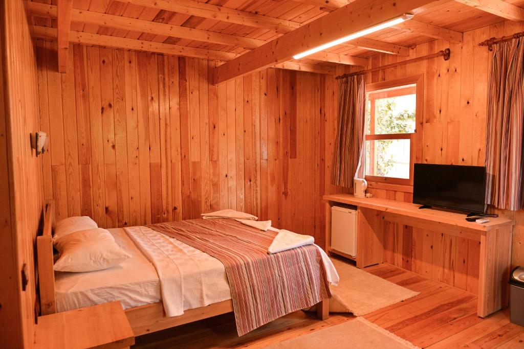 Postel nebo postele na pokoji v ubytování Tolay Hotel