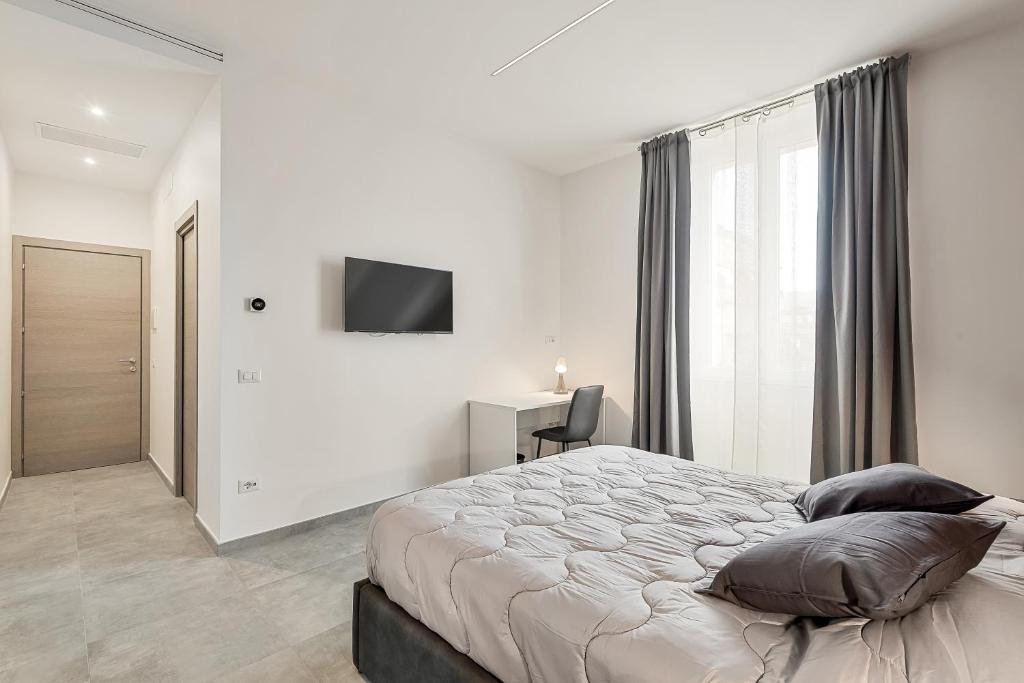 Postel nebo postele na pokoji v ubytování Home 501 Guest House - La Spezia