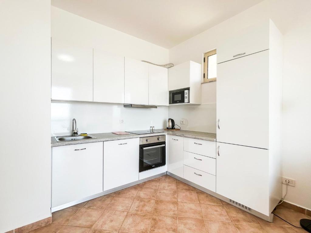 Kuchyň nebo kuchyňský kout v ubytování Oceanfront Oasis 770