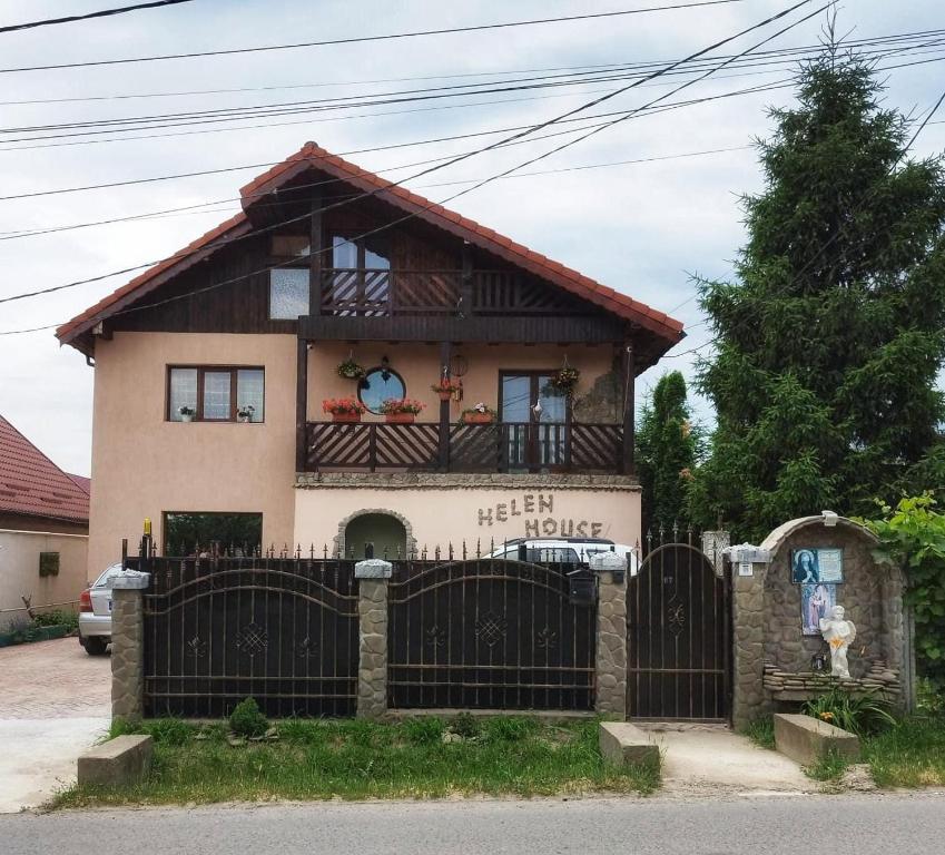 a house with a gate in front of it at Casa Helen House, Iasi in Valea Adîncă