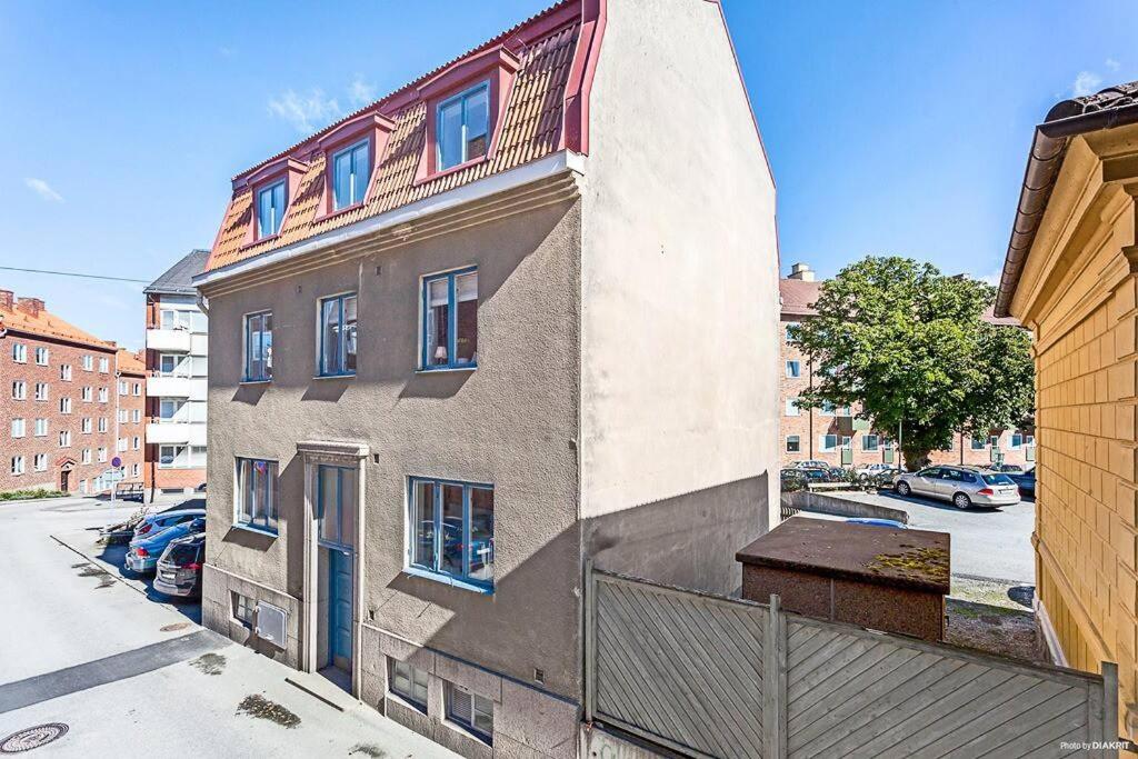 a building with a balcony on the side of it at Central lägenhet in Karlskrona