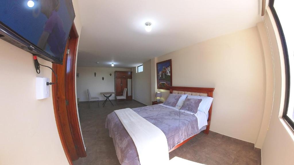 Postel nebo postele na pokoji v ubytování Hotel Suite Central Park Tababela