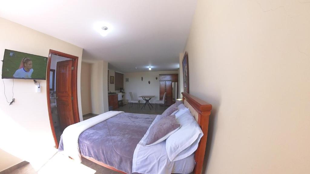 Postel nebo postele na pokoji v ubytování Hotel Suite Central Park Tababela