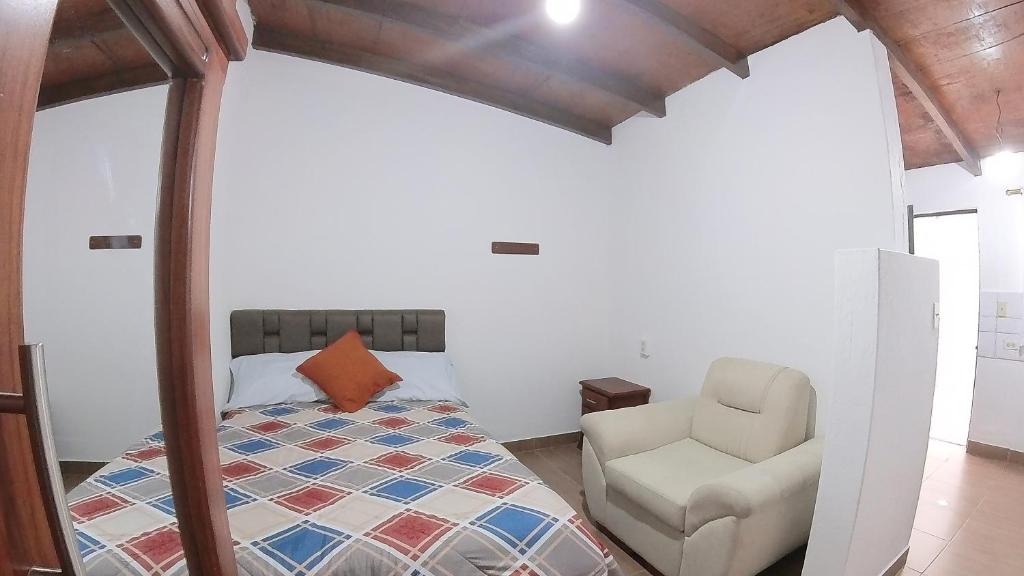 Postel nebo postele na pokoji v ubytování Hotel Suite Central Park Tababela