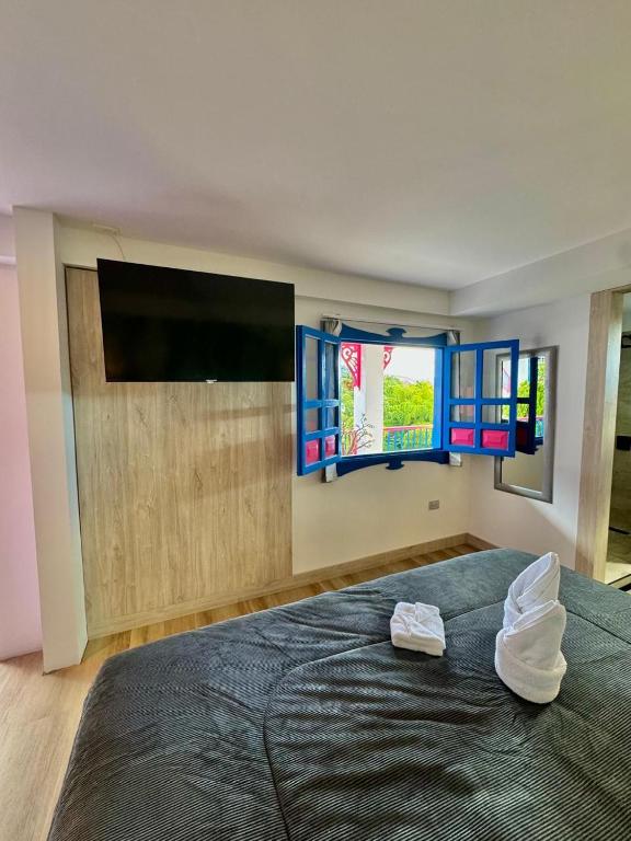 Postel nebo postele na pokoji v ubytování Hotel El Jardin