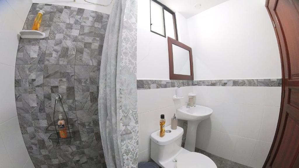 Koupelna v ubytování Hotel Suite Central Park Tababela