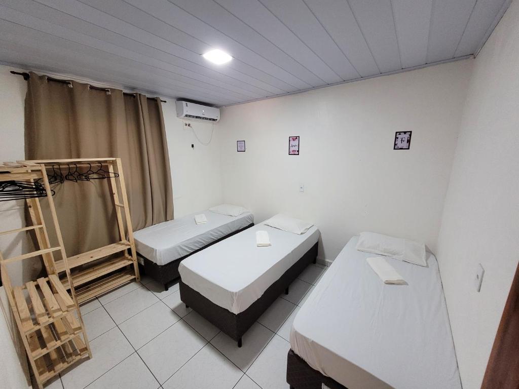 Postel nebo postele na pokoji v ubytování Casa Centro Itacoatiara AM