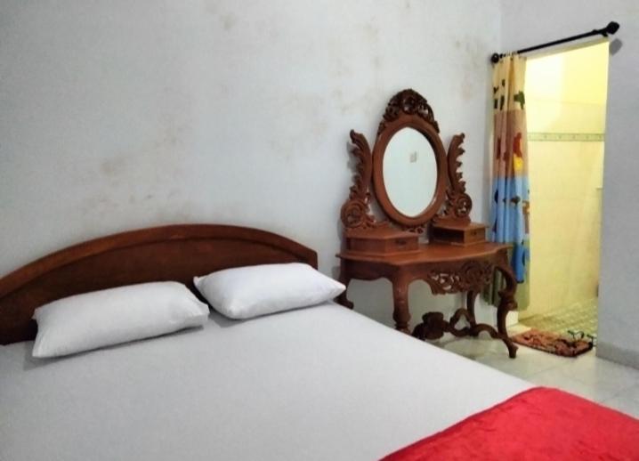 Katil atau katil-katil dalam bilik di Homestay Martocaroko