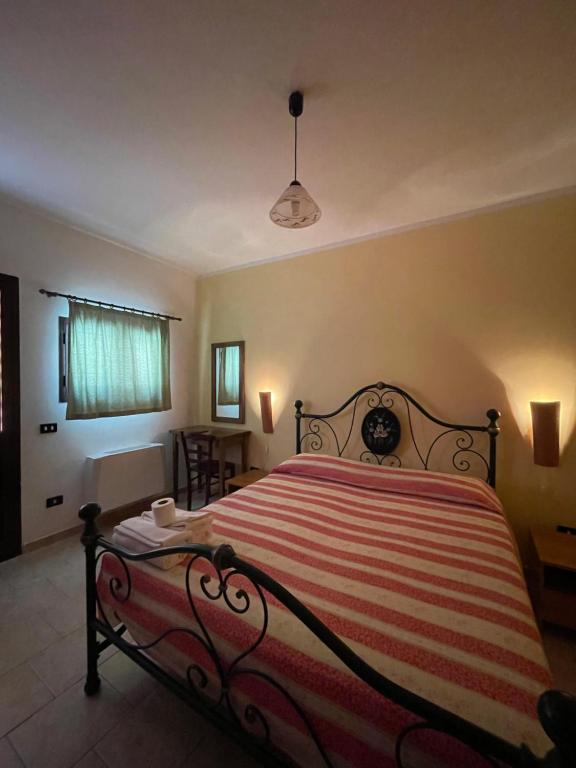 Postel nebo postele na pokoji v ubytování Agriturismo Salento Pietralata
