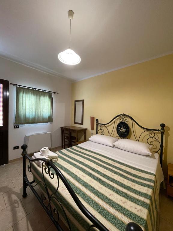 Postel nebo postele na pokoji v ubytování Agriturismo Salento Pietralata