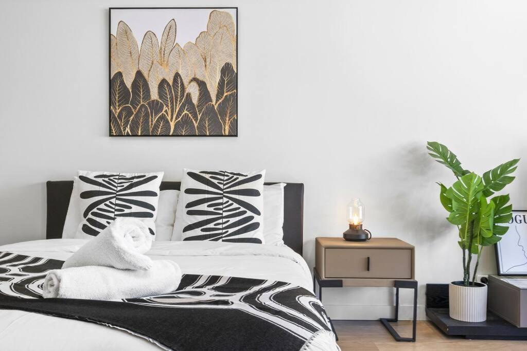a bedroom with a bed with a towel on it at Urban Oasis Studio in the Heart of City in Sydney
