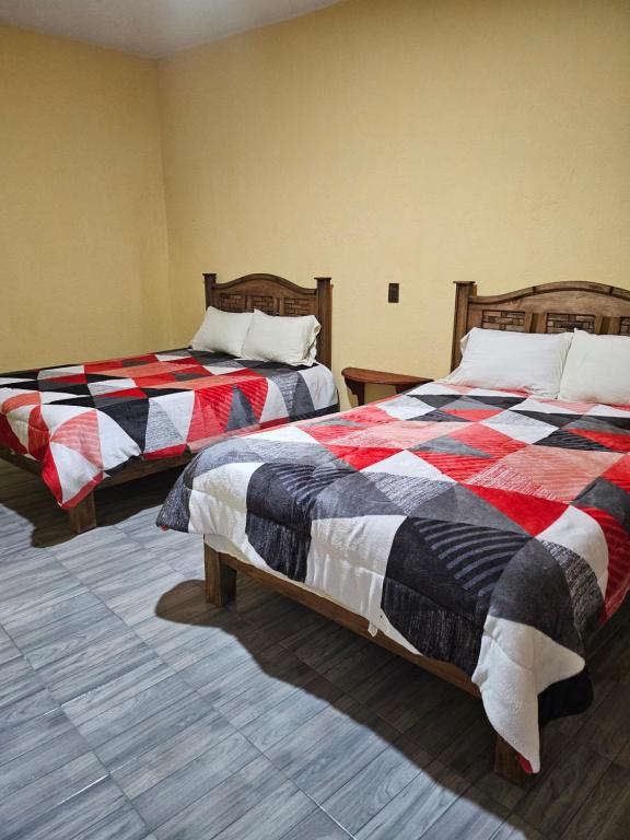 Postel nebo postele na pokoji v ubytování Hotel Villa Aurora