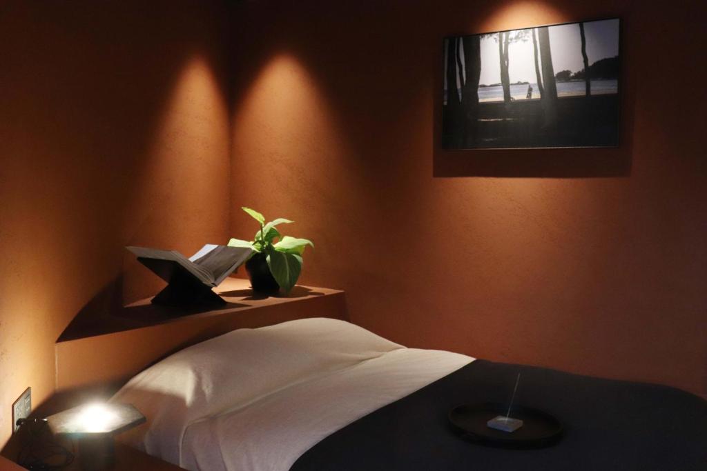 Postel nebo postele na pokoji v ubytování After Chapter Hotel Gwanganri