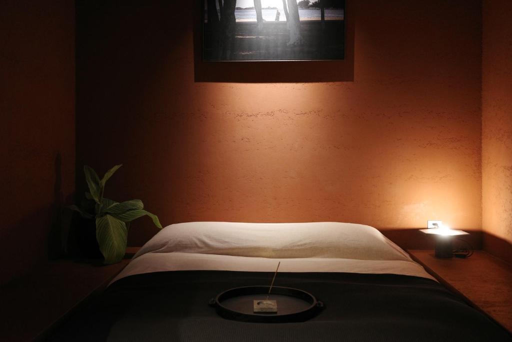 Postel nebo postele na pokoji v ubytování After Chapter Hotel Gwanganri