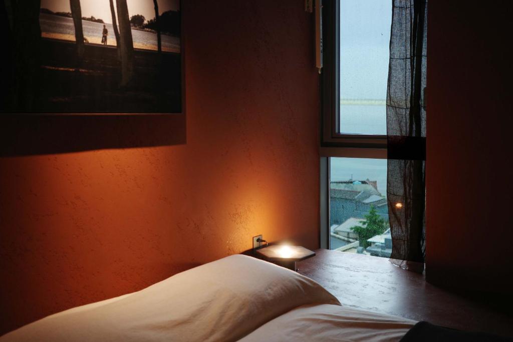 Postel nebo postele na pokoji v ubytování After Chapter Hotel Gwanganri