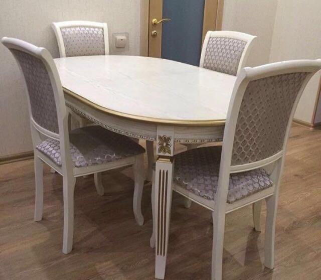 a dining room table with four chairs around it at great apartment in Madrid complex in Kirovo