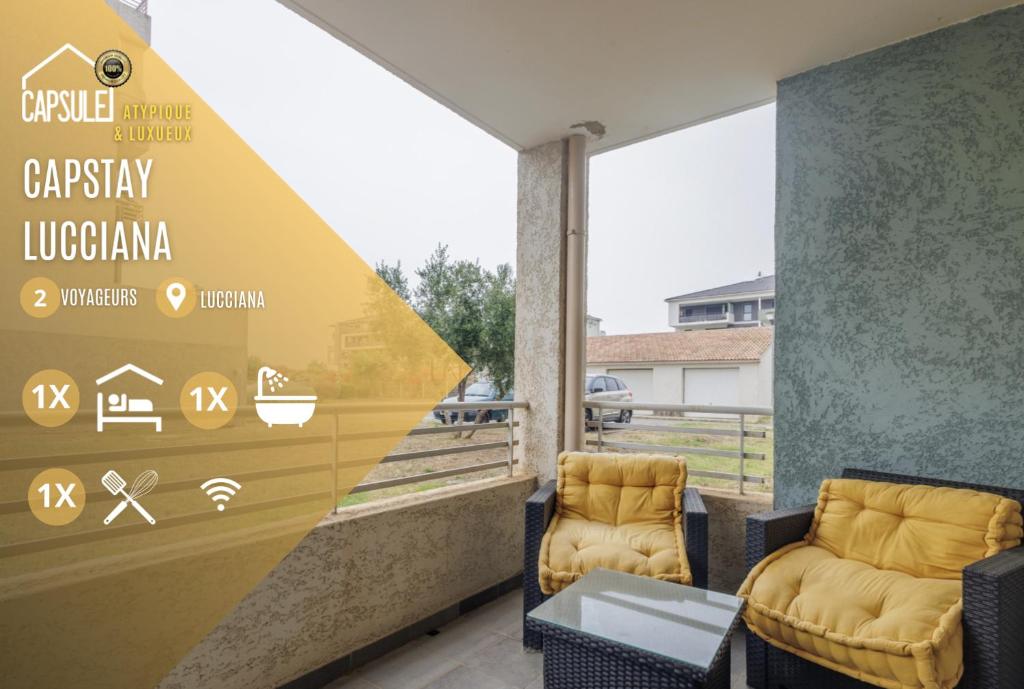 due sedie su un balcone con un cartello che recita epilessia lupita di Capstay studio avec grande terrasse proche aéroport Bastia - Lucciana - Centre a Lucciana