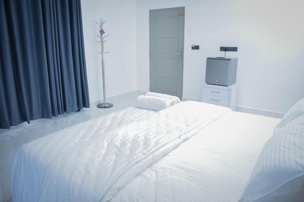 Postel nebo postele na pokoji v ubytování Trinco Caritas Guest Villa